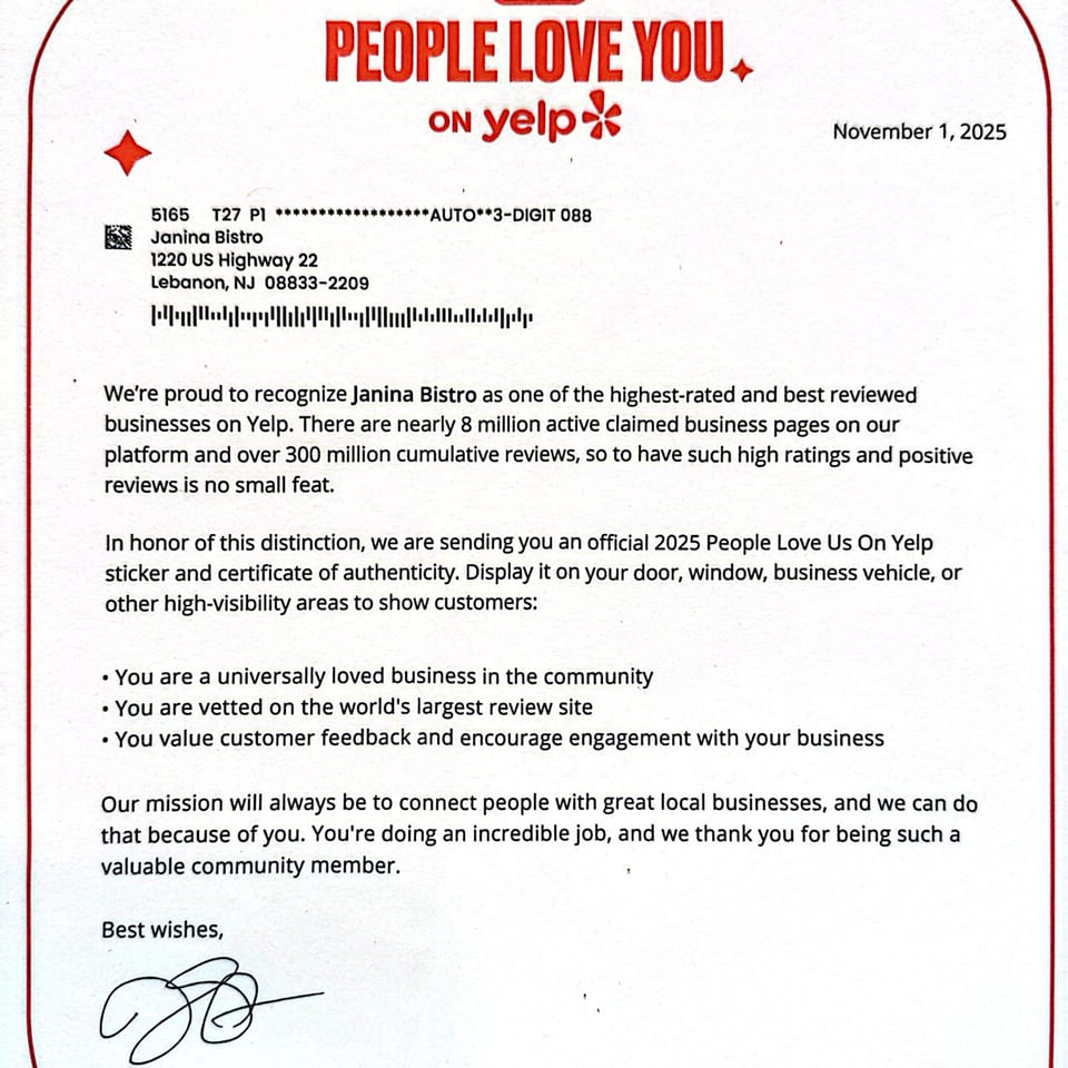 A letter from Yelp congratulating Janina Bistro for being a highly-rated and reviewed business.